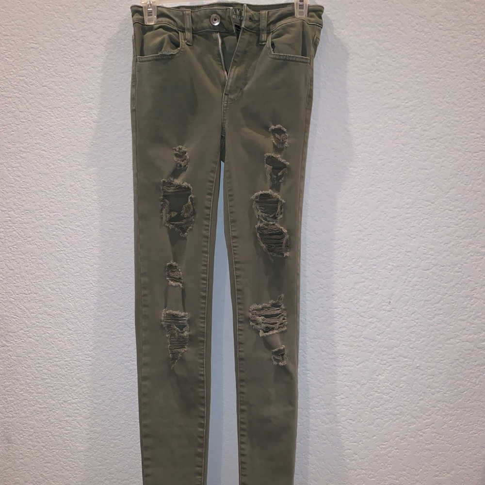 distressed green jeans